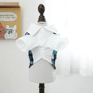 Detail of blue plaid pet tuxedo with white collar and buttons on a pet mannequin