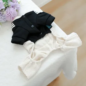 Cute black and white striped pet jumpsuit for dogs and cats on a lace tablecloth