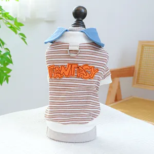 Close-up of pet striped shirt with FANTASY embroidery and metal D-ring for leash attachment