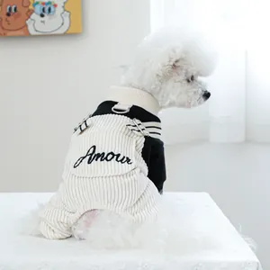 Detail view of monochrome pet jumpsuit featuring Amour embroidery and D-ring for leash attachment