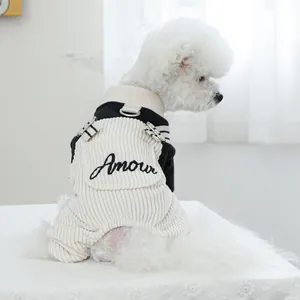Detail of pet dog overalls featuring cream corduroy fabric and Amour embroidery text