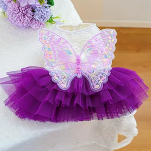 Detail of pet fairy dress showing purple gradient butterfly embroidery and pearl sequins
