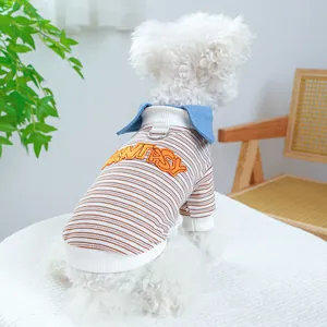 Detail of pet striped sweatshirt with FANTASY embroidery and blue collar on a dog