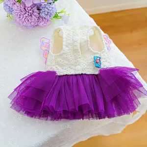 Detailed close-up of pet dress with lace bodice, purple mesh tutu and wing accents
