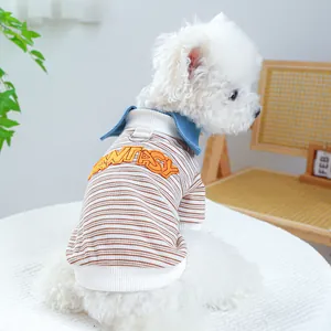 Detail of pet dog striped shirt featuring back embroidery and metal D-ring for leash attachment