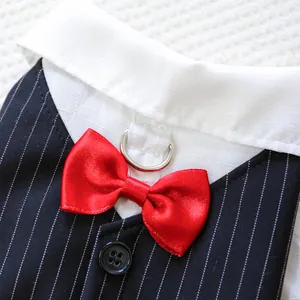 Detailed view of pet tuxedo vest with red bow tie and metal D-ring attachment