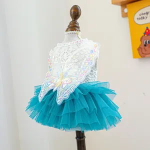 Detail of pet princess dress featuring crochet lace top and blue mesh skirt with butterfly