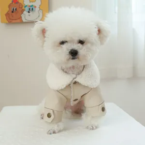 Close-up of cream faux leather dog winter jacket with soft warm fleece lining and buttons