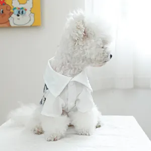 Elegant white lapel pet shirt for small dogs with textured fabric and button closure