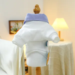 Detail of pet white sweatshirt featuring blue striped collar and soft knit cotton fabric