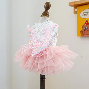 Detailed embroidery of colorful butterfly wings on a pink lace pet fairy dress