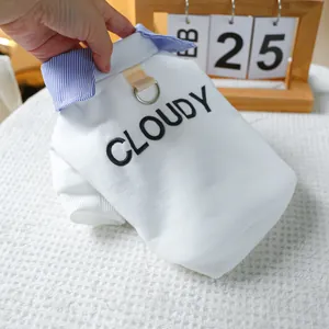 Close-up of pet shirt with striped collar, metal D-ring and Cloudy letter embroidery
