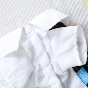 Detailed close-up of pet white shirt with breathable fabric texture and snap buttons