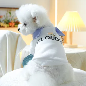 Close-up of white pet sweatshirt featuring a blue striped collar and metal D-ring hook