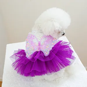 Detail of purple pet fairy dress featuring sequined butterfly embroidery and layered mesh