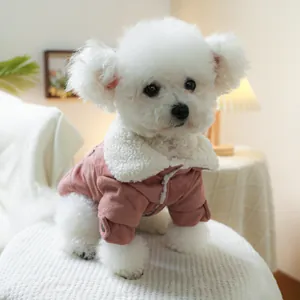Detail of warm pink faux suede pet jacket with thick white fleece collar on a Bichon dog