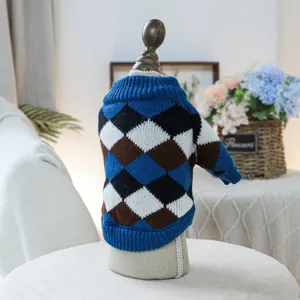 Detail of dog sweater showing soft argyle knit texture and blue ribbed neckline finishes