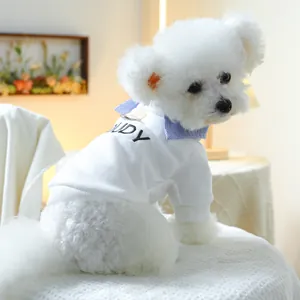 Detail of white pet sweatshirt with blue striped collar and black UDY embroidery