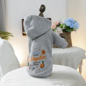 Detail of grey waffle knit dog hoodie with orange Angelles embroidery and metal D-ring