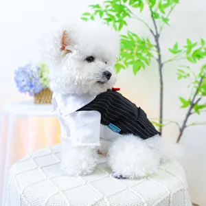Close-up of pet formal tuxedo suit featuring white shirt, red bowtie and pinstripe vest