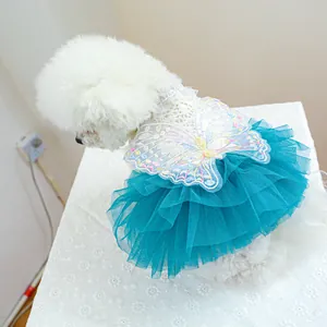 Detail of pet dress showing intricate butterfly embroidery and layered blue tulle skirt