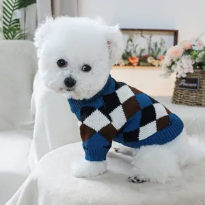 Small dog wearing a soft blue and brown argyle knit sweater with a cozy turtleneck