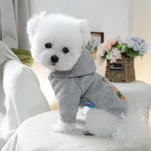 Close-up of grey waffle fabric pet hoodie with colorful vegetable embroidery on dog
