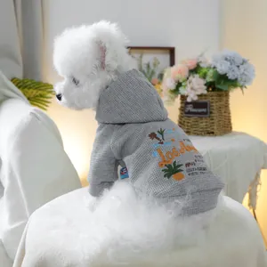 Detail of grey waffle knit dog hoodie featuring Los Angeles embroidery and palm patterns