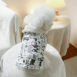 Close-up of pet winter coat with fleece collar and hand-drawn dog illustrations
