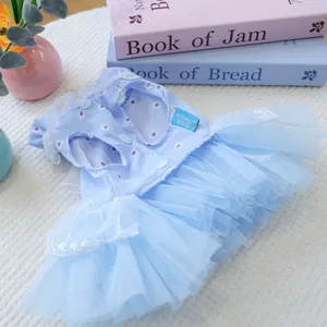 Detail of light blue pet fairy dress with daisy patterns and lace collar for small dogs