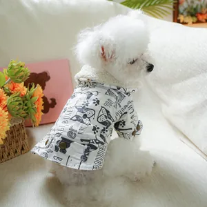 Detail of warm white dog winter jacket with fleece collar and cute dog breed print
