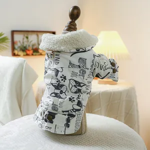 Detail of warm pet winter jacket featuring cartoon dog prints and cozy fleece collar