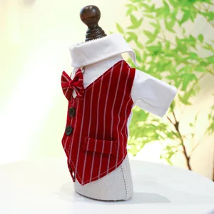 Detail of pet tuxedo vest featuring red stripes, white collar, and matching bow tie