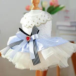 Close-up of pet princess dress with lace, gemstone heart, and large layered mesh skirt