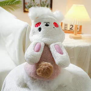 Close-up of pink and white plush pet hoodie with rabbit ears and soft fleece texture