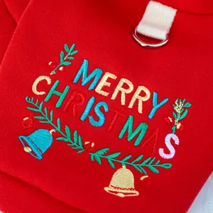 Detail of red pet hoodie with Merry Christmas embroidery and metal D-ring attachment