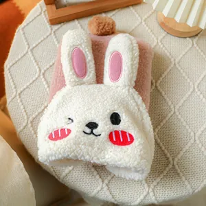 Detail of cute rabbit plush dog coat with warm faux fur lining and cartoon bunny design
