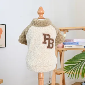 Detailed close-up of warm sherpa pet sweater with PB embroidery and raglan sleeves