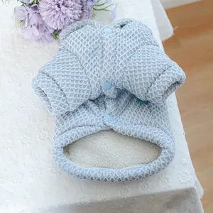 Light blue quilted pet vest with warm fleece lining and snap buttons detail