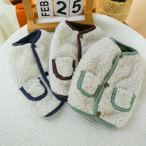 Close-up of warm fleece pet vests with contrast piping and cute pocket details