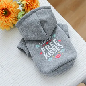 Detail showing the soft grey pet hoodie with I GIVE FREE KISSES print and heart patterns