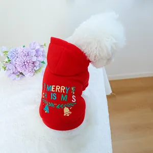 Detail of red Christmas dog hoodie featuring festive bell embroidery and Merry Christmas text