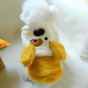 Detailed close-up of warm pet hoodie with cute bear embroidery and fluffy pompom detail