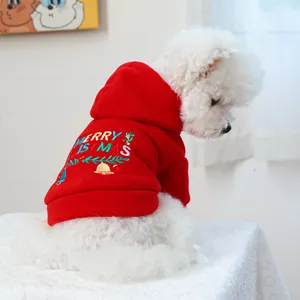Detail of red Christmas pet hoodie with Merry Christmas embroidery and bell motifs