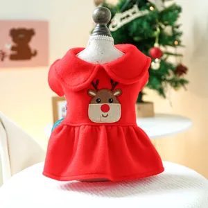 Detail of red festive pet dress featuring 3D reindeer embroidery and soft velvet fabric