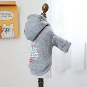 Detail of grey pet hoodie featuring Give Free Kisses print and soft knit fabric texture