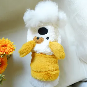 Detail of plush yellow pet jacket showing soft teddy fleece fabric and cute pom-pom