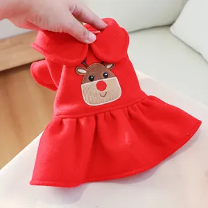 Detail of red Christmas pet dress featuring reindeer embroidery and dual-layer collar