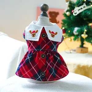 Close-up of pet Christmas dress featuring red plaid fabric and embroidered reindeer collar