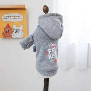Detail of grey pet hoodie with 'I GIVE FREE KISSES' print and soft knit texture